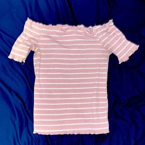 I’m selling a strapless t-shirt. It has a combination of pink and white